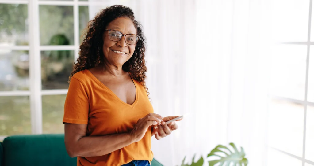 happy women looking at phone