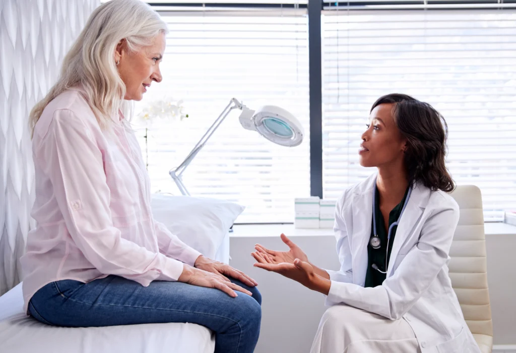 women talking to a female doctor